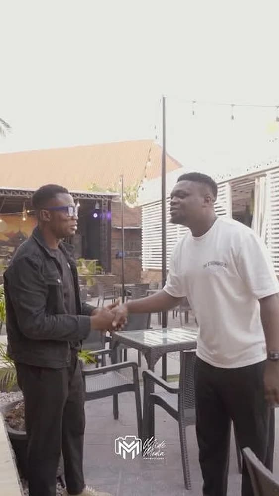 Two men shaking hands at the Ileya Fiesta venue