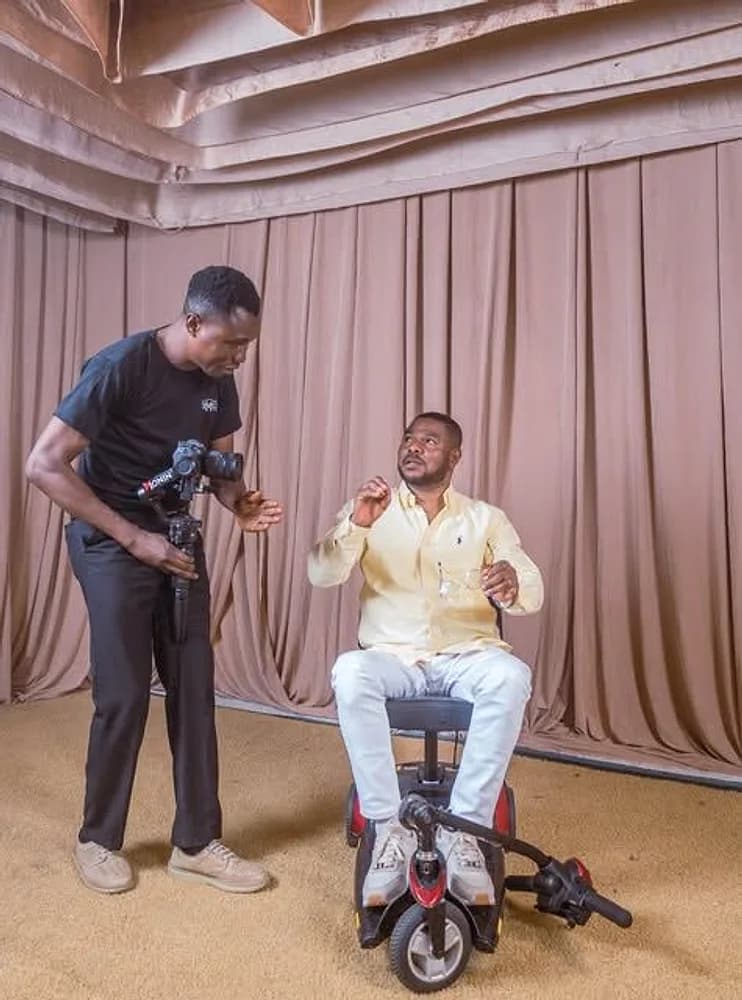 Director Mide filming an interview with a camera on a gimbal